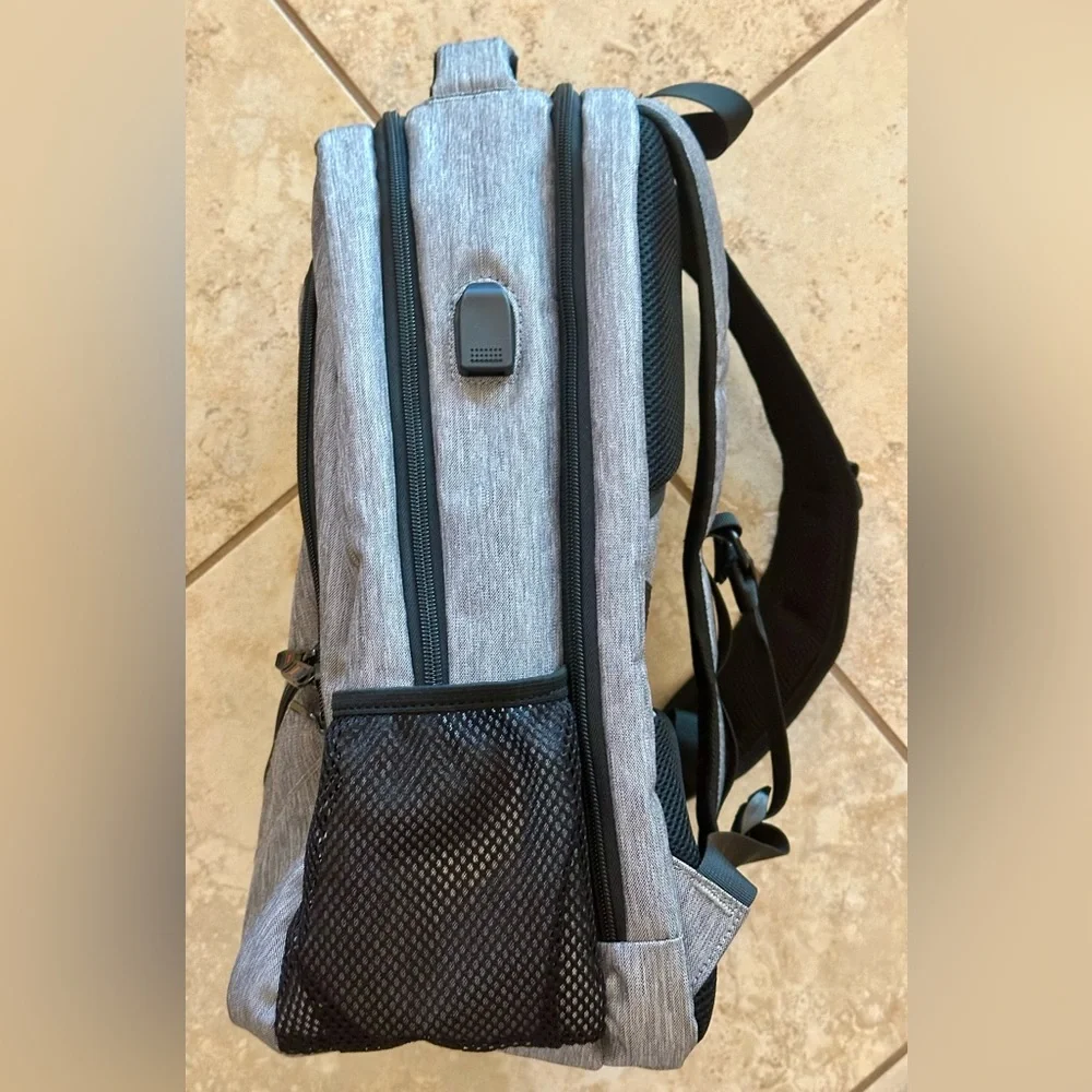Backpack Excellent condition! Lots of zip compartments. Grey black. Clean!